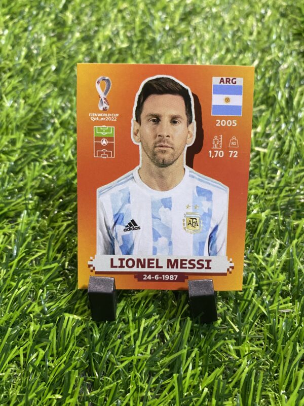 LARANJA: Figurinha do Messi (ARG19)- Álbum Copa do Mundo 2022 (Made in Italy)